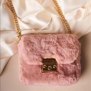 Polyester faux fur in pink with gold accents
